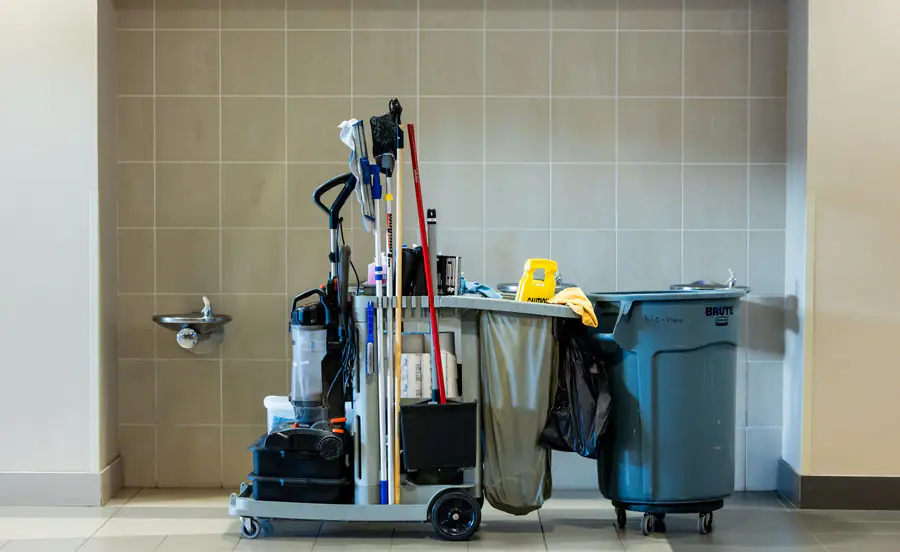 Stocked janitorial cart with cleaning supplies and consumables for office AMC