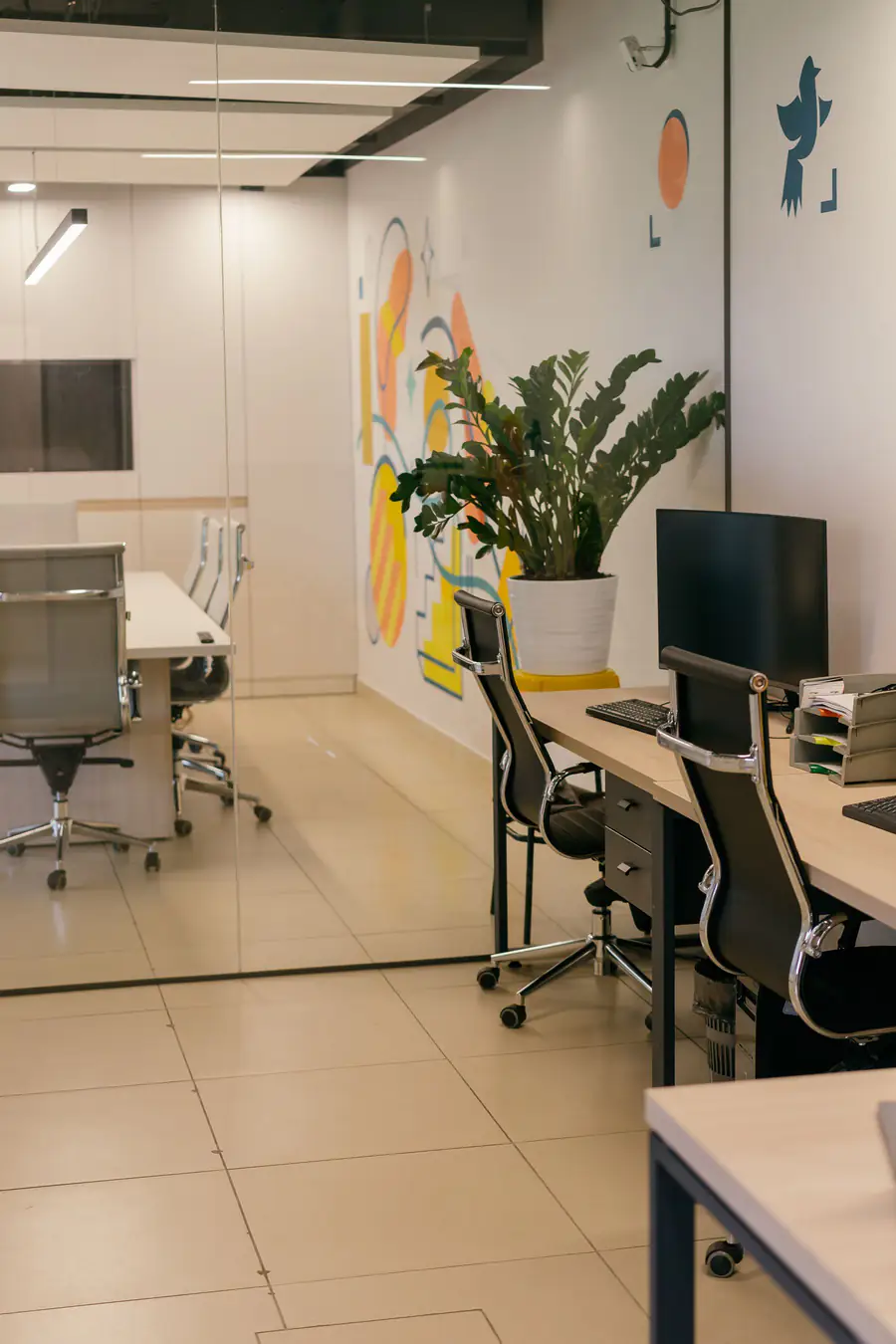 Clean office interior with glass partitions and workstations