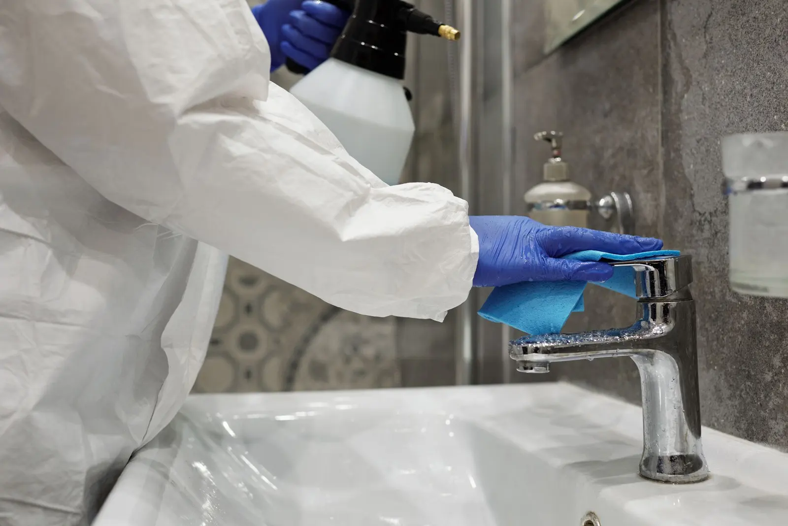 Bathroom sink and fixtures sterilized after a home sanitization service in Delhi