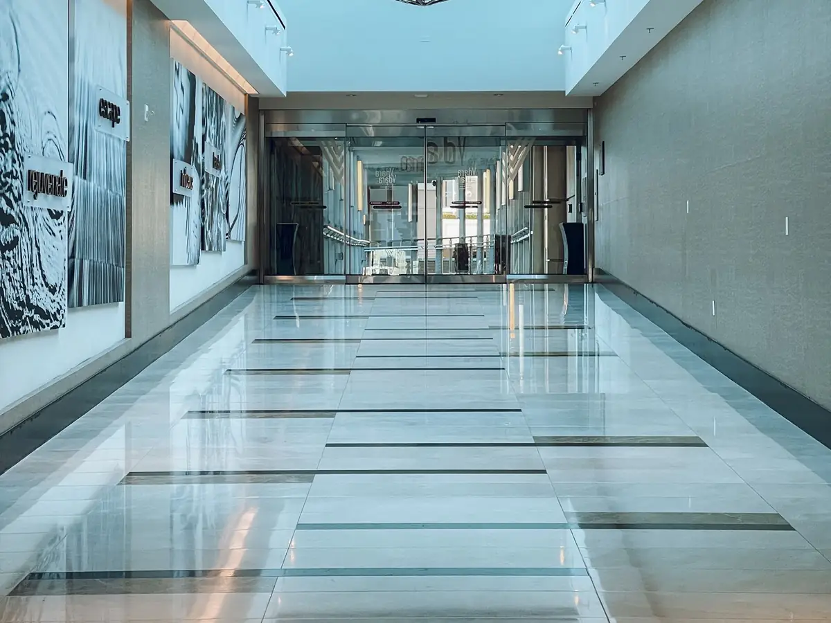 Polished marble floor with a mirror-like shine in a commercial corridor