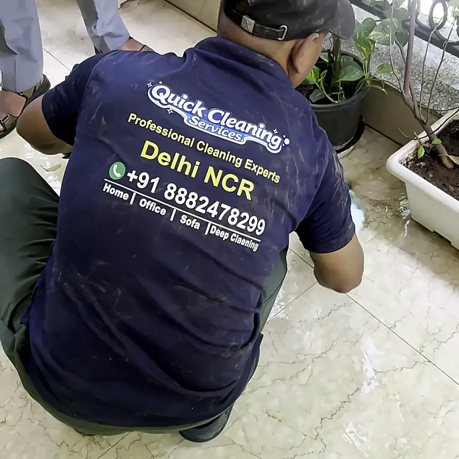 Quick Cleaning Services technician hand-detailing balcony floor edges and corners