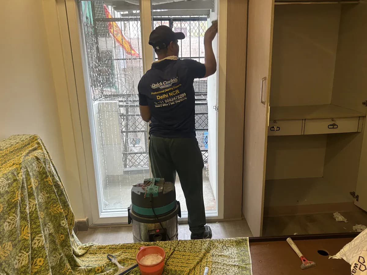 Technician cleaning window frame and track dust to improve indoor air quality in a Gurgaon home